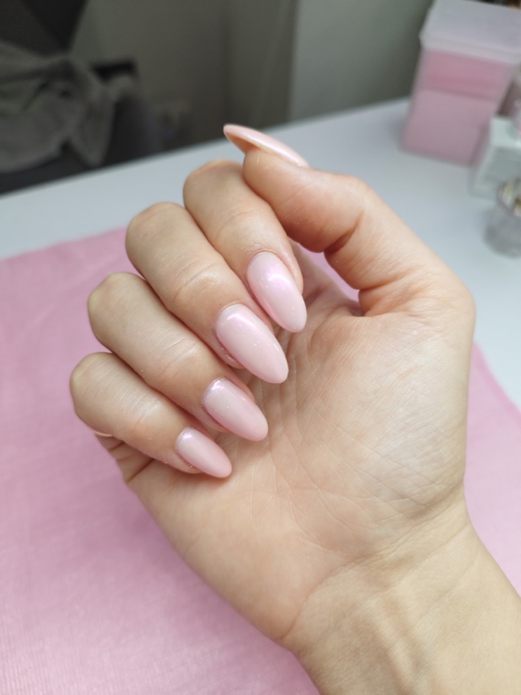 Soft pearl-pink almond gel nails, natural and glossy