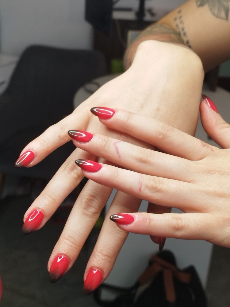 Bold red-to-black ombre almond gel nails